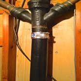 Main Stack Repair Before and after pictures of a cast iron main stack (drain pipe) repair.