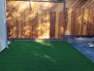clear-seal redwood fence and artificial turf