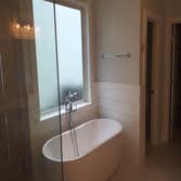 Daniel Island Master Bathroom Beach style Master Bathroom update with free standing tub, glass shower and ship lap siding and trim