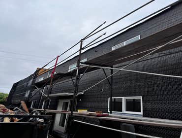 Photos by Santiago's Bay Builders Inc #1 Remodeling half of the building