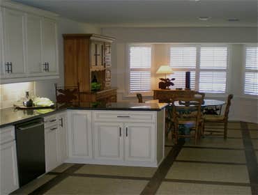 Traditional Kitchen Design The original kitchen of this typical Meyerland residence included an adjoining breakfast room which was incorporated into th