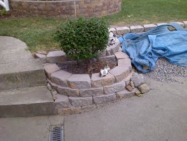 Wallstone Installation We created this beautiful wallstone wall around a garden in front of the house now the house has character and originality