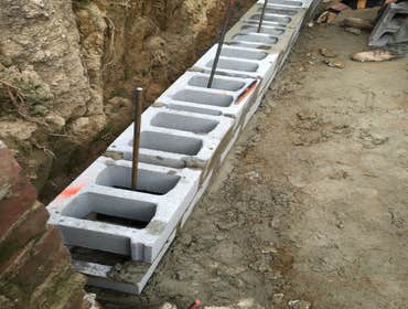 Philadelphia block retaining wall and concrete patio