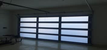 Photos by First Garage Door and Gates Repair, Inc #1 New installation of glass door full view 16’x7’
( glass and frame options )
New opener 3/4 belt 