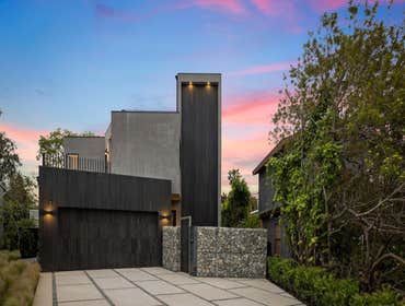 Woodgreen The Woodgreen House is sited with careful consideration of landscape and solar orientation, preserving six mature fruit trees that anchor the