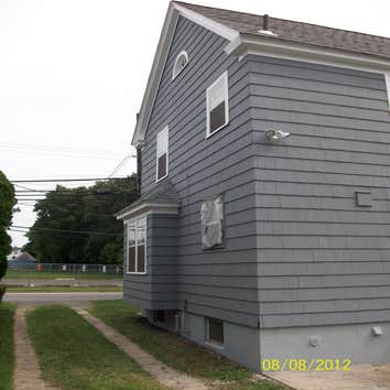 Brilliant Painting, LLC Exterior Project 1 Before and after photos of a full house that has been power washed, scraped, hand sanded, primed, and painte
