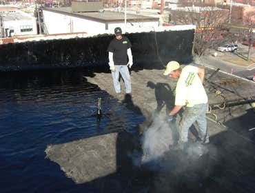 Hot tar repair and flood coat