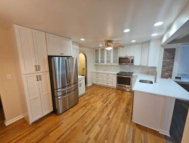 Photos by M&c Global Construction LLC #9 This Odenton, MD, kitchen remodel transformed the space with quartz countertops, recessed lighting, custom cab