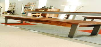 Project photos from Dagan Design & Construction Custom steel and walnut dining benches