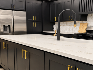 Kitchen Remodel This luxury kitchen remodel combines bold design with premium craftsmanship, featuring custom black shaker cabinetry, brushed brass har