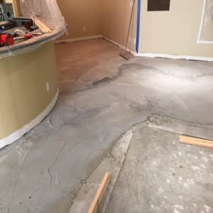 Basement leveling Broomfield, CO Basement with 2-6 inches of drop. Demo, infill and self-leveled the floor