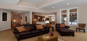 Lockridge Residence This new Transitional Custom Home was built on the owners heavily wooded lot and designed to maintain the woodsy feel while taking 