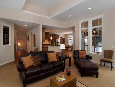 Lockridge Residence This new Transitional Custom Home was built on the owners heavily wooded lot and designed to maintain the woodsy feel while taking 