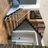 Photos by Brainz & Brawn Structures Inc #1 Stainless Steel bar handrail.. multi-tier stainless railing for interior staircase and basement access.