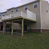 15'x15' deck with privacy fence 15'x15' rear deck with vinyl railing and side privacy fence.