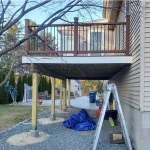 Photos by Triple Infinity LLC #5 Build open deck extension 18x12, 6x6 post and footings—composite decking and handrails.