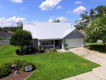 Metal Roof in Gainesville FL This is an energy saving metal roof in Gainesville FL, after installation temperatures in the attic were lowered by 50 deg