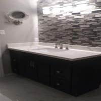 Photos by Top Notch Construction, LLC #1 Demolition for primary bathroom, enlarge door (handicap accessible), remove closet to increase space, install 