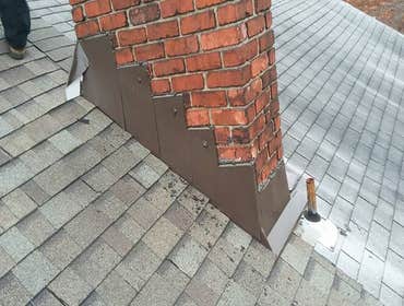roofs Complete install of one half of a duplex roof. I chalked a life down the center of the 2 houses. I ran ice and water down were the new shingles w