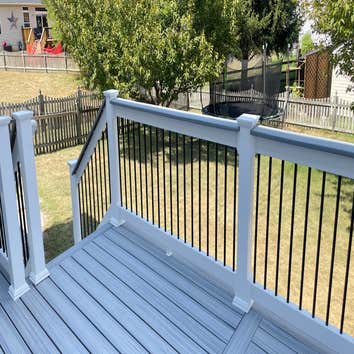 New Build: Trex Enhanced Decking with White Vinyl Railing New deck build with Trex Enhanced decking boards and Vinyl railing with black round aluminum 