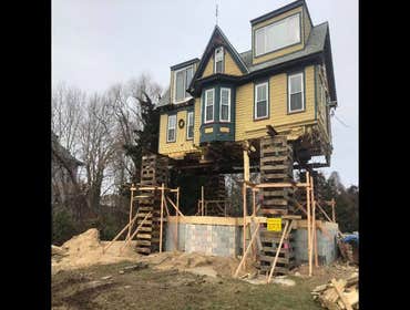 Photos by Dennis Creek House Movers LLC House raised to allow reconstruction of first floor