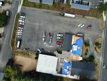 Isaac Roof Construction Commercial Roof Project Flat roof replacement with a minimum R-value of R-30 and a Class A Fire rating.