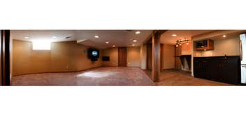 Basement Full basement remodel including: Home theater system, wet bar, microwave, refrigerator, office/bedroom, storage, glass block windows, carpet a