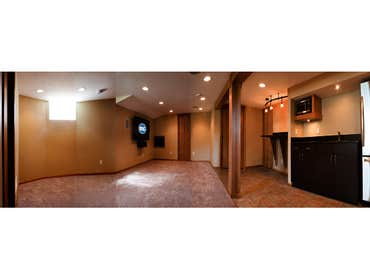 Basement Full basement remodel including: Home theater system, wet bar, microwave, refrigerator, office/bedroom, storage, glass block windows, carpet a