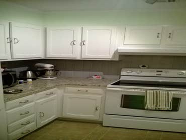 whole house remodel Kitchen remodel, resurfaced cabinets, tile backsplash, new vinyl plank flooring (click together), new custom toe kicks, transition 