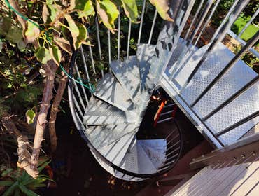 Spiral Staircase & Custom Deck Handrailing This was a great addition to this beautiful beach side home. We installed a galvanized steel spiral staircas