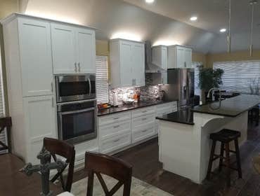 Photos by Woodman Remodeling #3 Before and after shots of kitchen and fireplace
