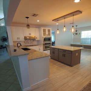 This kitchen remodel showcases a complete transformation, blending modern design with functionality to create a welcoming and efficient space. ...