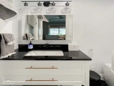 Studio City Bathroom Remodel We turned this Studio City bathroom into your modern, elegant escape! Picture a white vanity with brass handles and a bold