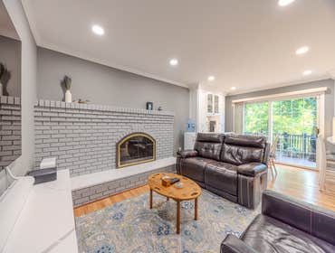 Home Renovation Check out this cozy and modern living room renovation! From the freshly painted brick fireplace to the sleek recessed lighting, this sp