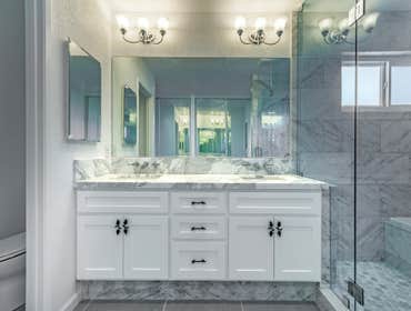 Redwood City, CA Perfect blend of grey and white tones give this bathroom an elegant yet timeless feel for years to come with heated floor and black an