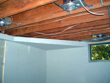 Project 1, building a basement with a powder room, Project 2, restoration of ceder shingles & shutters Framing over concrete, installing electric ligh