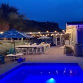 Coastal Cottage Outdoor Kitchen and Pool