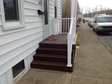 Project photos from Griesemer Construction The exterior of this porch was old deteriorated concrete with a aluminum posts & roof.Now it's trex lumber d