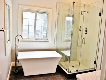 Artistic Modern Modern bath from an artistic client - Full master bathroom remodel that was designed with heavy input from the client. Bathroom feature