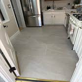 Photos by Fresh Start Renovations LLC #3 Large Format Tile Installation: Kitchen & Dining Area
Installation of large-format tiles with a critical focu
