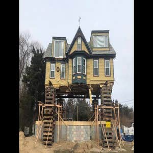 Photos by Dennis Creek House Movers LLC House raised to allow reconstruction of first floor
