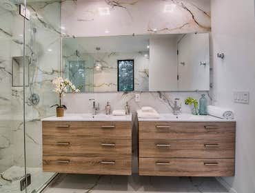 Marble Master Bathroom Renovation During the renovation, we adorned the bathroom with elegant Italian Porcelain tiles on both the floor and walls, resu