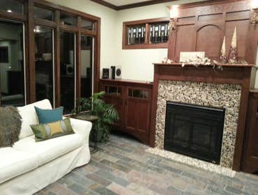 Sunroom with stone fireplace