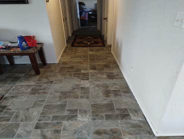 Rowlett, Texas Demo 1000 sq ft of carpet and vinyl plank floor and installation of 1000 sq ft of ceramic tile. Painted interior walls. Design and insta