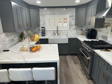 Kitchen Remodel In Los Angeles Ca Dark Gray Shaker Cabinets with Calacata Rocky Quartz & Marble 6X12 Full Backsplash
