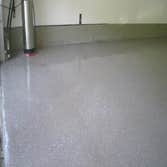 Custom garage floor insalling a custom designed and colored floor in a high end restaraunt.