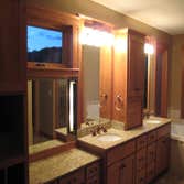 Electrical Solutions WI LLC Kitchen that is missing refrigerator front panels. Master Bathroom sink area