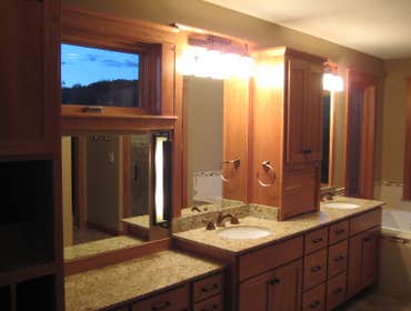 Electrical Solutions WI LLC Kitchen that is missing refrigerator front panels. Master Bathroom sink area
