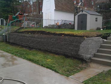 Project photos from Hollis Contracting We tore down the existing wall to rebuild it with solid block and pour freshly made steps.