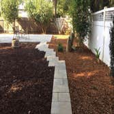 Landscaping Brand new paver patio, drought tolerant landscape with a 2 tone mulch. Customer loves their low maintenance backyard that will stay for yea